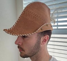 This handcrafted leather Robin Hood hat is perfect for archers looking to step up their look on the field, LARP, or any other occasion where you want to look like a dashing outlaw. I have noticed if you wear these in a bar, you will be the star of the bar. They are also great for business meetings or networking events where you need to stand out of a crowd.  It is made from high-quality 4 oz leather and features a forward-facing peak, a folded brim with dome-shaped rivets, and a peacock feather Robin Hood Hat, Hood Hat, Feather Decor, David Webb, Networking Event, Business Meeting, Robin Hood, Peacock Feather, Handcrafted Leather