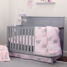 The 8-piece Elephant Pink & Grey Dreamer Collection crib set includes an adorable double-sided comforter featuring pink, grey and white mini dot elephant silhouettes on a baby pink background trimmed with grey border. The comforter backside features a circle mini print in grey and white. Includes two 100% cotton crib sheets - one a playful grey and white circle pattern, the second a pink, grey and white elephant print. A solid grey dust ruffle with a pink and grey border of elephants completes t Elephant Baby Bedding, Elephant Crib Bedding, Baby Elephant Nursery, Grey Crib, Girls Bedding Sets, Circle Print, Bedding Sets Online, Crib Bedding Set, Baby Bedding Sets