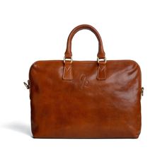 "Description: Discover the perfect blend of style and functionality with our handcrafted leather laptop bag. Crafted from full-grain, vegetable-tanned leather, this bag boasts a semi-rigid construction that retains its impeccable shape for any occasion.  Thanks to its generous size and multiple compartments, including two internal zipped pockets, it effortlessly accommodates all everyday essentials, from tablet to notebook to personal items. Perfect for modern professionals who appreciate qualit Professional Leather Satchel For Daily Use, Professional Leather Laptop Bag For Everyday Use, Classic Leather Laptop Bag With Sleeve, Professional Laptop Bag With Leather Lining For Everyday Use, Professional Leather Briefcase For Daily Use, Modern Business Shoulder Bag In Vegetable Tanned Leather, Classic Leather Laptop Bag With Smooth Grain, Modern Vegetable Tanned Leather Shoulder Bag For Business, Professional Leather Briefcase With Laptop Sleeve