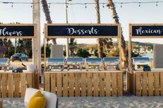 there are two signs that say desserts on the sand at this beachside restaurant