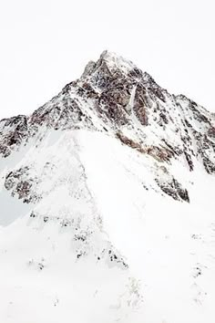 a snow covered mountain is shown in the foreground, with no clouds on it