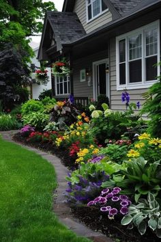 Mixed Garden Bed, Rounded Flower Bed Ideas, Flower Garden Front Of House, Garden Bed Layout Flowers, Colorful Front Landscaping, Pretty Yard Ideas, Wild Flower Garden Front Yard, Mums In Flower Bed, Shade Landscaping Ideas Backyards