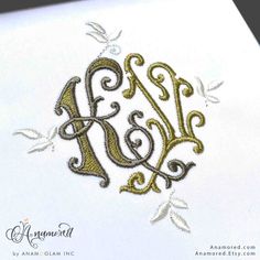 an embroidered monogram on a white card