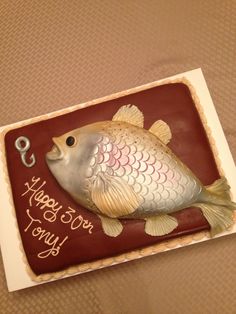 a birthday cake with a fish on it