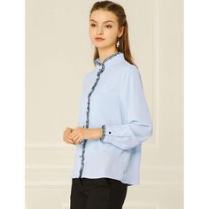 Add a bit of a feminine feel with the ruffled stand collar button-down shirt. Featuring long sleeves, ruffle stand collar, contrast color piped, and soft chiffon fabric. A flattering contrast color trim on the collar placket and cuffs adds pretty details, perfect for a weekday meeting or night out. Match with jeans or a skirt for a weekend casual look. Lightweight and comfortable for all-day wear. This blouse is versatile and can be styled in various ways to suit different occasions. The solid c Spring Office Tops With Stand Collar, Workwear Blouse With Button Cuffs And Stand Collar, Elegant Long Sleeve Light Blue Blouse, Elegant Light Blue Long Sleeve Blouse, Blue Blouse With Ruffled Collar For Daywear, Elegant Light Blue Collared Blouse, Elegant Light Blue Buttoned Blouse, Elegant Light Blue Blouse With Buttons, Elegant Blue Blouse With Ruffled Collar