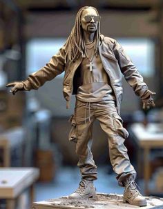 a statue of a man with dreadlocks on top of a table