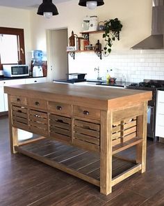 a kitchen island made out of wooden crates