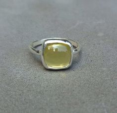 Natural Yellow Lemon Quartz Ring, 925 Sterling Silver Ring, Lemon Quartz Cushion Ring, Lemon Quartz handmade ring, Bridesmaid gift Main Stone : Lemon Quartz Stone Shape : Cushion Stone Size : 10 mm (Approx) Metal : 925 Sterling Silver Finish : Silver / 14K Gold Vermeil / 14K Rose Gold Vermeil Setting type : Bezel Setting  Please Note As with all Natural Gemstones The colors and inclusion patterns if applicable may vary slightly. WE ARE HERE ONLY FOR OUR CUSTOMER...WE WILL BE GLAD TO ASSIST YOU. Lemon Quartz Ring, Cushion Ring, Etsy Bridesmaid Gifts, Silver Jewelry Rings, Lemon Quartz, Quartz Ring, Quartz Stone, Bridesmaid Gift, 925 Sterling Silver Ring