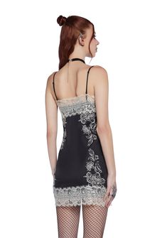 cuz you are worshiped. This slip dress has a satin construction, floral embroidery on the front and back, lace detailing, adjustable shoulder straps, and a side zipper closure. Lace Slip Dress With Contrast Lace For Night Out, Black Spaghetti Strap Dress With Lace Closure, Black Dress With Lace Closure And Spaghetti Straps, Black Slip Dress With Contrast Lace For Night Out, Sleeveless Slip Dress With Contrast Lace For Night Out, Black Lace Slip Dress With Spaghetti Straps, Sleeveless Contrast Lace Slip Dress For Night Out, Fitted Lace Slip Dress With Patchwork, Fitted Satin Slip Dress With Lace Patchwork