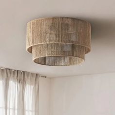 a light fixture hanging from the ceiling in a room