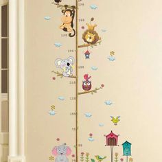 the growth chart wall decal is decorated with animals and birds