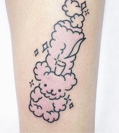 a tattoo on the leg of a woman with clouds and stars flying above her head