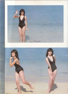 a woman in a bathing suit standing on the beach with her hand up to her face