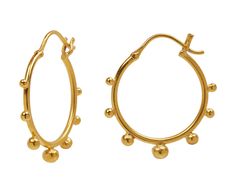 With their fun, eye-catching design, these Jane Diaz earrings instantly up the ante of any look. The gold plated hoops have varying sized decorative balls along their exterior and fasten with gold plated latch backs. Cool, casual and perfect for every day, these earrings are an interesting alternative to the classic pair of hoops.total length : 1 1/4"gold balls : vary : 2mm diameter to 4mm diameter eachgold plated hoop diameter : 1 /16"gold plated latch back closure Sevan Bicakci, Daniela Villegas, Digby And Iona, Alice Cicolini, Rebecca Overmann, Decorative Balls, Wire Hoop Earrings, Zoe Chicco, Cathy Waterman