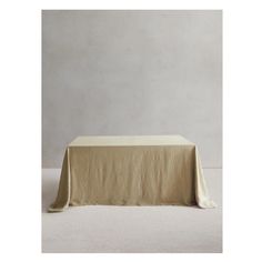 an empty table with a white cloth on it