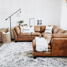 a living room with two couches and a rug