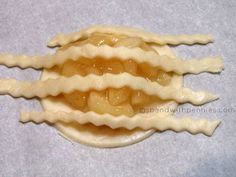 some kind of food that is on a white tablecloth and it looks like an animal's teeth