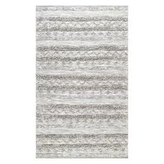 an area rug with grey and white stripes on the bottom, in front of a white background