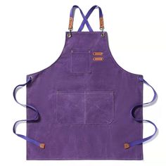 a purple apron with two straps hanging from it's front and side pockets, on a white background