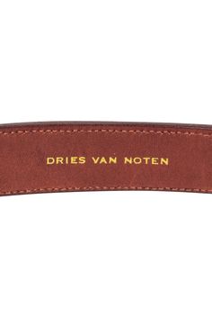 Add some luxe leather to any look with this Dries Van Noten belt! Adorned with sleek brown and black paneling and a chic knotted design on buttery soft leather, this must-have accessory is sure to tie any casual outfit together. Pair with a flowy sundress and strappy sandals for a sweet and summery look you can rock all season long! Leather Gunmetal-toned hardware Buckle closure Black paneling w/ knotted design Length (clasped) 13" Length (long) 37" Designer Brown Leather Belt, Designer Brown Belts For Workwear, Classic Leather Belt With Leather Trim, Brown Leather Belt With Leather Lining, Black Paneling, Flowy Sundress, Black Panels, Dries Van Noten, Buckle Belt