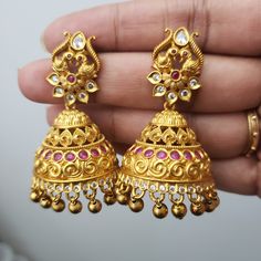 Pls, Note The hair extension jewelry shown in the 2 pics is just for display and not included in the price. Handmade Indian Temple Jewelry, best to wear it for traditional ceremonies or Indian weddings. This bridal jewelry has an ethnic finish. It has very small Cubic Zircon stones. It is a Bollywood style one gram jewelry These Jhumka Earrings set has an excellent finish and gives out an exquisite sense of style. If you are looking for an amazing Fashion Jewelry set for special occasions such a Gold Kundan Earrings For Marriage, Wedding Jhumkas With Intricate Dangle Design, Wedding Dangle Jhumkas With Intricate Design, Wedding Temple Jewelry Danglers With Tilla, Traditional Heavy Earrings For Marriage, Festive Temple Jewelry Earrings For Marriage, Ornate Kundan Danglers For Wedding, Festive Kundan Earrings For Marriage, Heavy Chandbali Earrings For Marriage