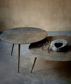 two round tables sitting on top of each other