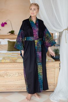 A stylish design can come in different shapes and colors, and artisan Saktut Raitawati knows how to create a garment full of that unique Balinese glamour. Working with cotton, the artisan crafts this black robe with a hand-stamped rainbow pattern embellishing the three-quarter-length sleeves and front, adding a matching belt for comfortable wear. Fitted Multicolor Cotton Kimono, Bohemian Robes, Surrealist Art, Shapes And Colors, Rainbow Pattern, Women Artisans, Balinese, Artisan Craft, Dressed Down