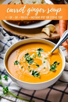 carrot ginger soup with parsley in a white bowl