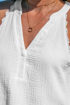 Refresh your style with our White V-neck Lace Trims Sleeveless Top. Its chic design exudes charm and sophistication, perfect for layering or wearing solo on warmer days. With its flattering neckline and intricate detailing, this camisole effortlessly elevates your wardrobe with timeless style. Product code: CAA04A4B007CC Features:  Woven Sleeveless V neckline Ruching Lace Trims Wash Method: Regular Wash Material: 100%COTTON. Elegant V-neck Tank Top For Summer, Elegant V-neck Tank Top For Vacation, Chic V-neck Tank Top For Vacation, Chic V-neck Camisole For Day Out, Chic Sleeveless V-neck Top For Summer, V-neck Vest Blouse For Day Out, Elegant Tank Top For The Beach, Chic Summer V-neck Tank Top, Chic Beach Vest In Camisole Style