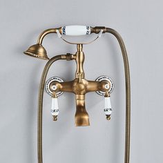 an antique brass faucet with three lights on it