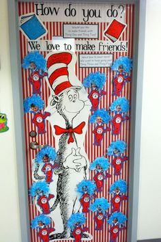 the cat in the hat door is decorated with red, white and blue flowers for dr seuss