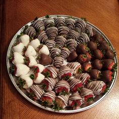 a platter filled with chocolate covered strawberries