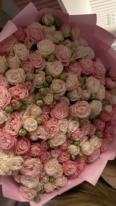 a large bouquet of pink and white roses