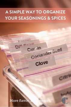 plastic containers filled with cloves and labeled to organize your seasonings and spices