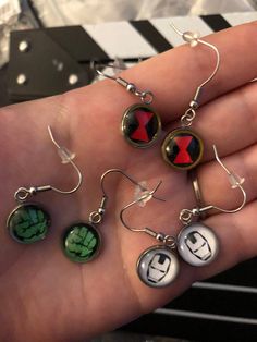 Handmade Marvel Inspired Stainless Steel Earrings—Choose Your character Themed Black Metal Jewelry, Nickel-free Themed Stainless Steel Jewelry, Themed Nickel-free Stainless Steel Jewelry, Nickel Free Themed Black Jewelry, Novelty Black Round Jewelry, Black Round Novelty Jewelry, Nickel-free Round Surgical Steel Jewelry, Avengers Jewelry, Marvel Earrings