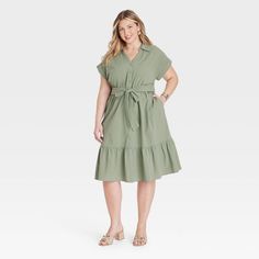 Take on any day in cool style donning this Short-Sleeve Tiered Midi Shirtdress from Ava & Viv™. Made of lightweight gauze cotton, this midi dress is tailored with a collared neckline featuring a full-length button placket down the front, short dolman sleeves with rolled cuffs and functional side pockets. A sash-tie belt for cinching your waist and a tiered hem for a frilly finish complete the look. Pair it with your fave accessories and sandals for an outfit that will be sure to impress. Green Dresses Casual, Olive Green Dress Casual, Light Olive Green, Maxi Bodycon Dress, Green Dress Casual, Olive Green Dresses, Mini Skater Dress, Flare Mini Dress, Midi Short Sleeve Dress