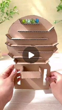 someone is making an origami robot out of cardboard