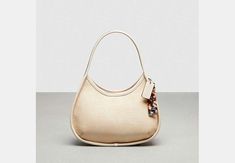 Ergo Bag In Croc Embossed Coachtopia Leather | COACH Sling Bag Mini, Chic Dressing, Iconic 90s, Leather Scraps, Coach Outlet, Leather Coach, New Uses, Recycled Leather, Leather Items