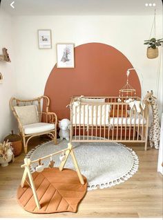 a baby's room with two cribs, a rocking chair and a rug on the floor