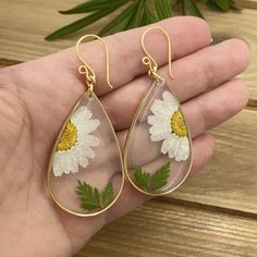 Original real flower earrings made real daisy and leaf, encased in resin in the teardrop gold plated. A truly special and beautiful way to bring nature with you wherever you go! The earrings are LIGHTWEIGHT! Dainty gift for her. When buying my jewelry you may be sure it is original and truly one of a kind ♥ I T E M ~ D E T A I L S: * Lenght: 2.7 inch * Wide: 1.2 inch * Drop length: 1.9 inch * Materials: UV resin, real pressed flower, gold filled wire, gold plated, nickel free. ♥ GIFT IT Jewelry White Teardrop Nature-inspired Jewelry, Botanical Drop Earrings With Birth Flower, Botanical Birth Flower Drop Earrings, Bohemian Birth Flower Drop Earrings, White Pressed Flower Drop Earrings, White Pressed Flowers Drop Earrings, White Drop Earrings With Pressed Flowers, Bohemian Dangle Jewelry With Pressed Flowers, White Teardrop Jewelry With Pressed Flowers