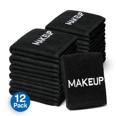 twelve black towels with the words make up on them and one is in front of it