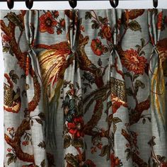 the curtain is decorated with birds and flowers