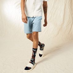 Tropical socks that pack a punch! Our Tropical Floral socks are decked in blue and bright orange hibiscus flowers, bringing you the feel of island vibes anyplace, anytime. These stylish crew-length tropical socks are the perfect fit for men looking for a fashionable, fun, and vibrant style. They're loud but not overwhelming; conversational if you want them to be. Perfect for a tropical-themed party or a gloomy Tuesday at work, these Tropical Floral socks will brighten your day and those around y Casual Blue Socks For Spring, Casual Multicolor Socks For Summer, Casual Multicolor Summer Socks, Casual Blue Socks For Summer, Blue Cotton Socks For Summer, Comfortable Blue Socks For Summer, Comfortable Blue Summer Socks, Comfortable Cotton Summer Socks, Casual Cotton Summer Socks