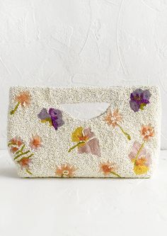 Intricately beaded to give the appearance of pressed, dried flowers on a white backdrop, this stunning clutch has us dreaming up more reasons to get dressed up. Material Glass beads with white satin lining Size 10" wide x 6.5" tall x 2.25" deep Closure Magnetic snap closure Details (cont.) Interior slip pocket Origin M Dried Flower Beads, Beaded Clutch, Dried Floral, White Backdrop, Beaded Purses, Beaded Bags, Canvas Pouch, Butterfly Design, White Satin