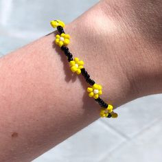 ♡ Black and yellow flower seed bead bracelet. Single bracelet. ♡ Fits ~16 cm wrists. Second photo is shown for bead scale! ♡ Made with elastic string, so allows stretching, but please be gentle! ♡ NOT made in a pet-free household Flower Seed Bead, Bead Things, Single Bracelet, Black Beaded Bracelets, Seed Bead Bracelet, Black Flower, Seed Bead Bracelets, Black And Yellow, Yellow Flower