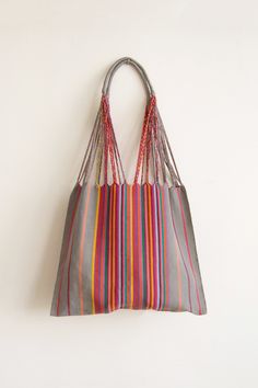 These versatile totes are handwoven by artisans in Chiapas, Mexico on a backstrap loom. Perfect for a beach day, the farmer's market, or as an everyday purse! This bag is approx. 16" wide x 26" tall with the strap. Due to the handmade nature, height and width of bag can vary up to 10%. Hammock Bag, Inkle Weaving, Handwoven Bag, Backstrap Loom, Textile Bag, Everyday Purse, Handwoven Fabric, Farmer's Market, Weaving Patterns