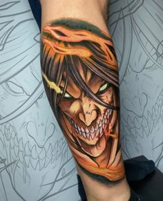 a man's arm with a tattoo on it that has an image of a demon and