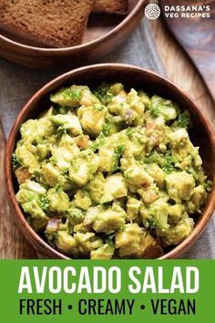 avocado salad in a bowl with bread on the side