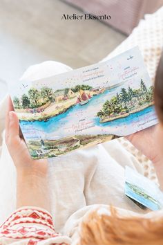 a woman is reading a book on the bed