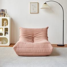 a living room filled with furniture and a lamp